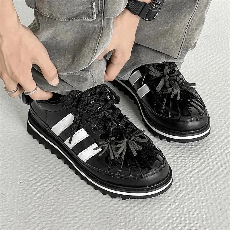 Black Adidas Sneakers with White Stripes and Chunky Sole