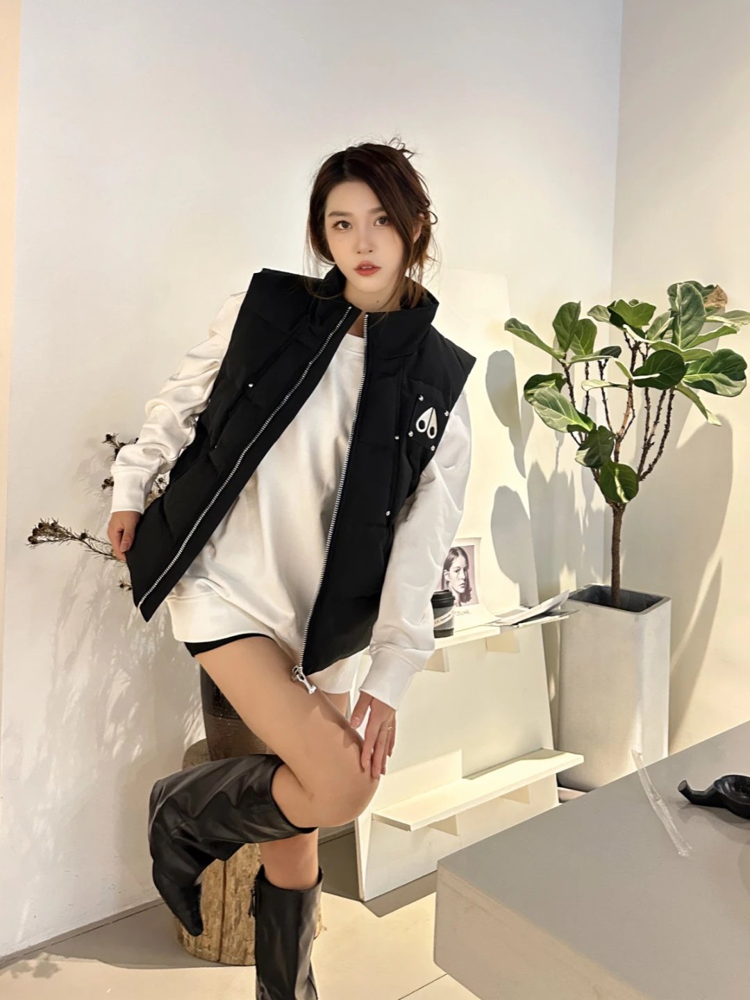 Stylish Black Quilted Vest with Zipper and Logo Design